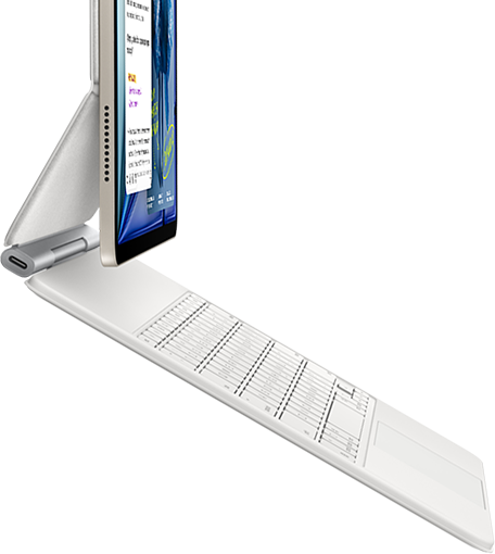 iPad Air, color blanco estrella, acoplado a un Magic Keyboard, color blanco, lateral exterior