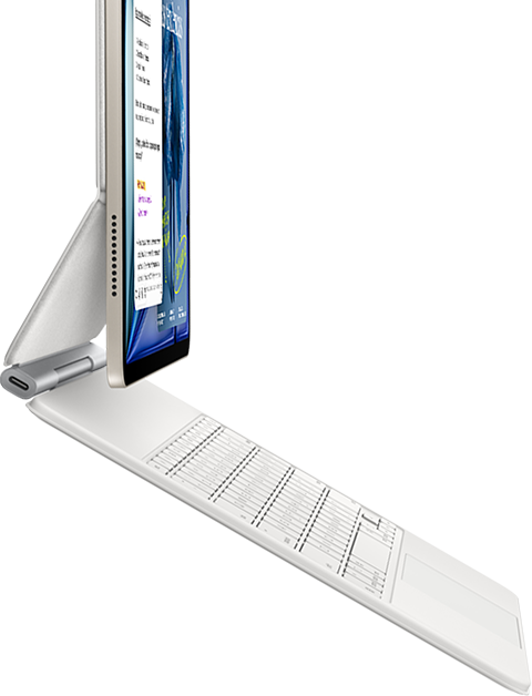 iPad Air, color blanco estrella, acoplado a un Magic Keyboard, color blanco, lateral exterior