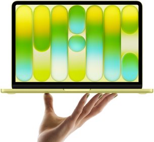 MacBook Neo en color cítrico, portátil sobre las puntas de los dedos de una mano abierta, diseño abstracto a todo color en la pantalla